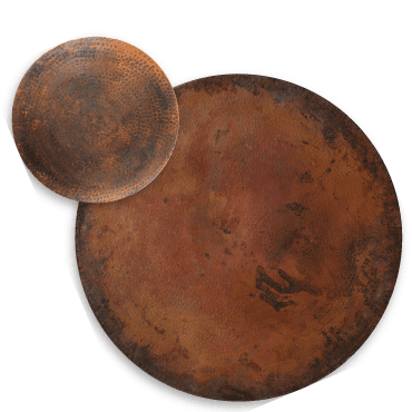 A set of two copper plates on a white surface.