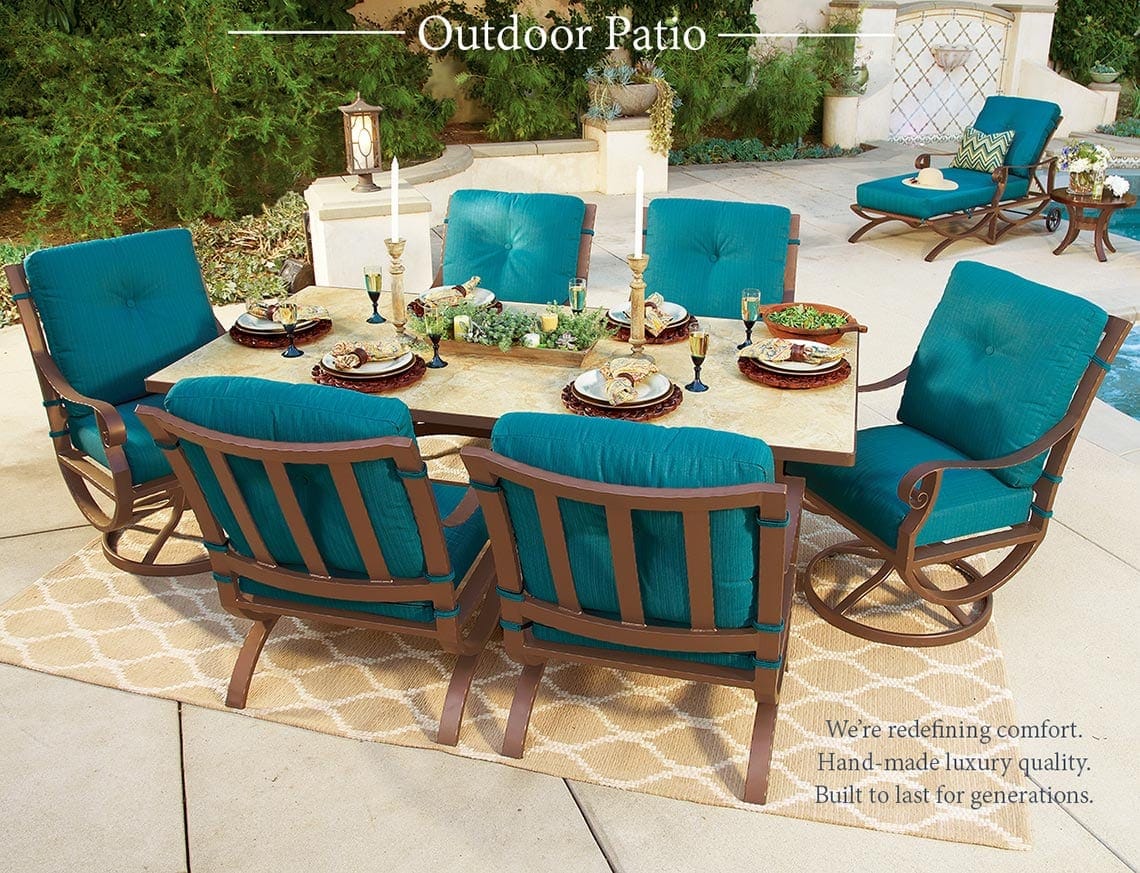 An outdoor patio with a table and chairs.