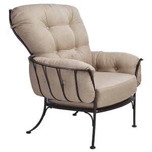 An outdoor lounge chair with a tan upholstered seat.