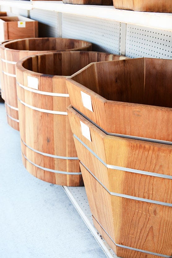 A row of wooden planters in a store.