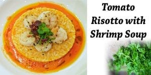 Gourmet tomato risotto with succulent shrimp, prepared using fresh ingredients from a nearby garden center or plant nursery.