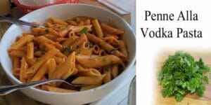 A savory bowl of pasta topped with parmesan cheese and adorned with fresh parsley.