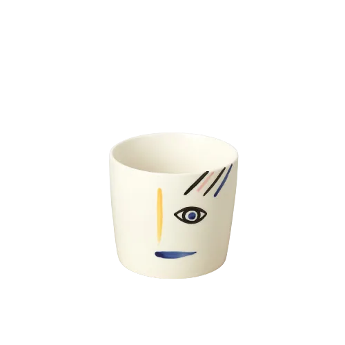 A white cup with a face on it, sold at a top garden center near me.