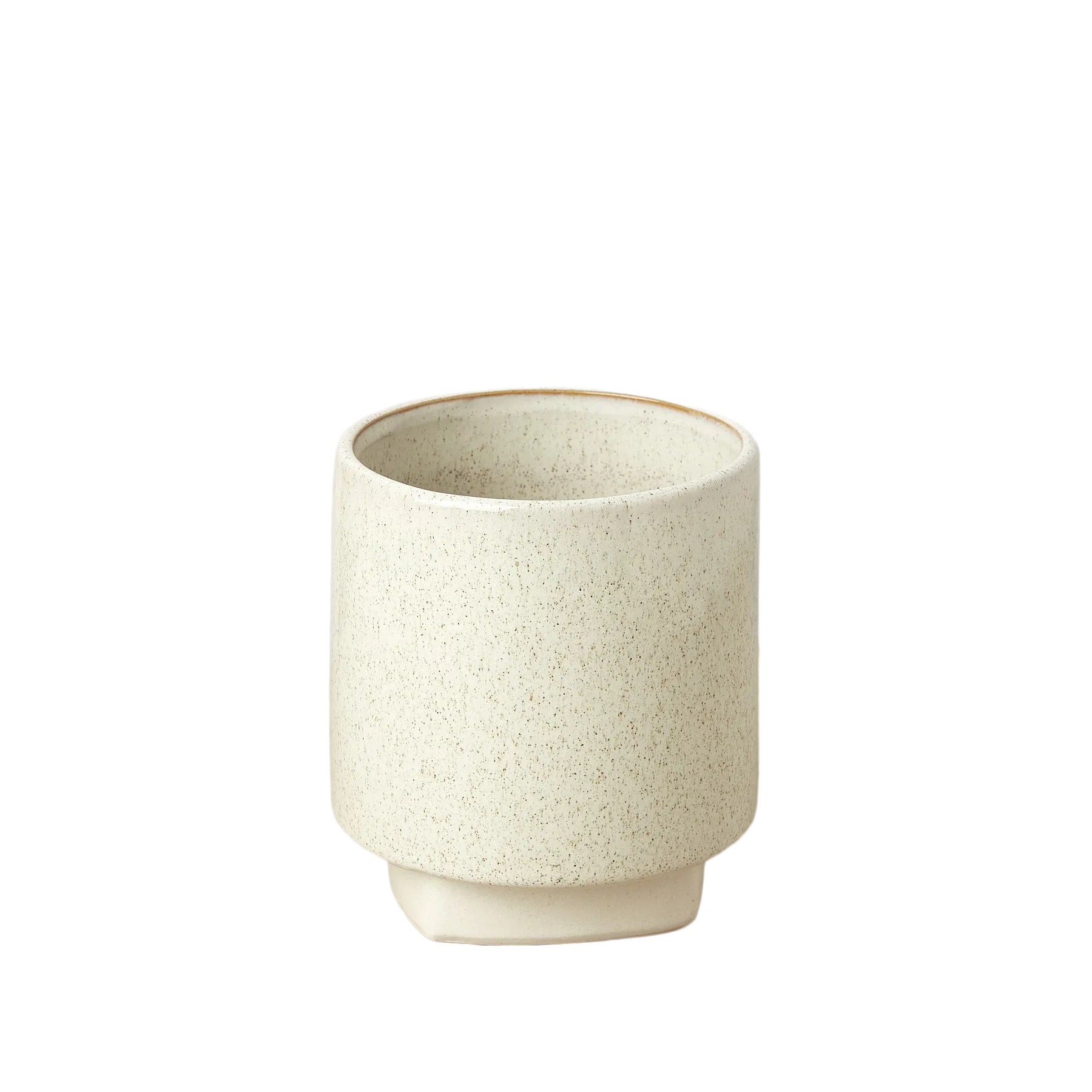 A small white ceramic pot on a white surface at the best nursery near me.