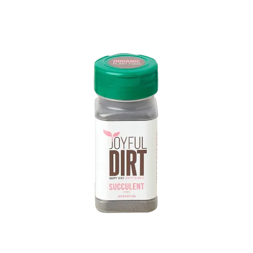 A bottle of joyful dirt on a black background at the best garden nursery near me.