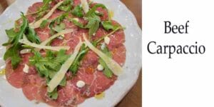 A plate with beef carpaccio from the best Italian restaurant near me.