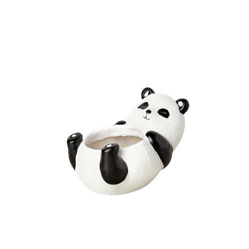 A panda bear sitting on a garden background.