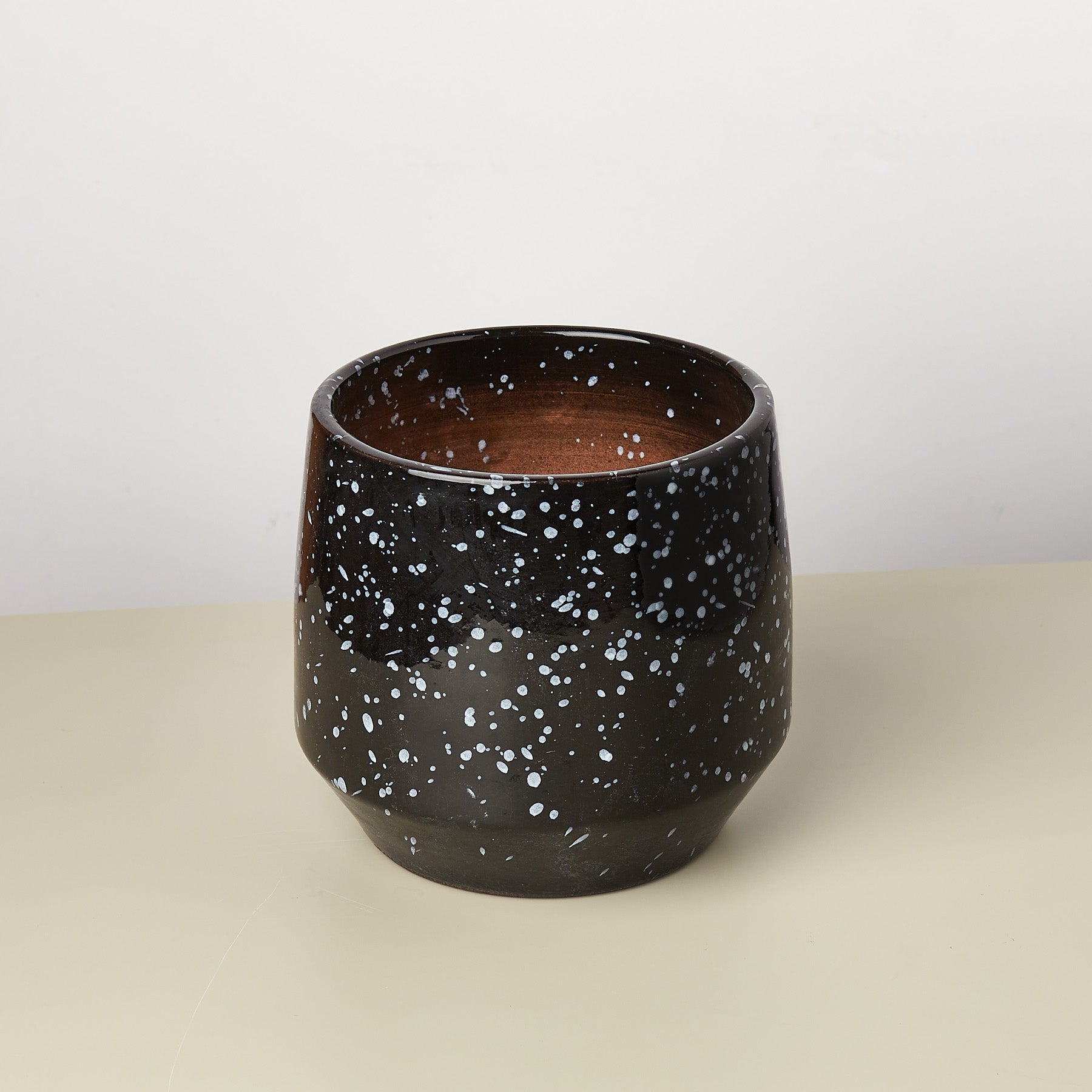 A black and white pot with speckles, perfect for your top garden center near me.