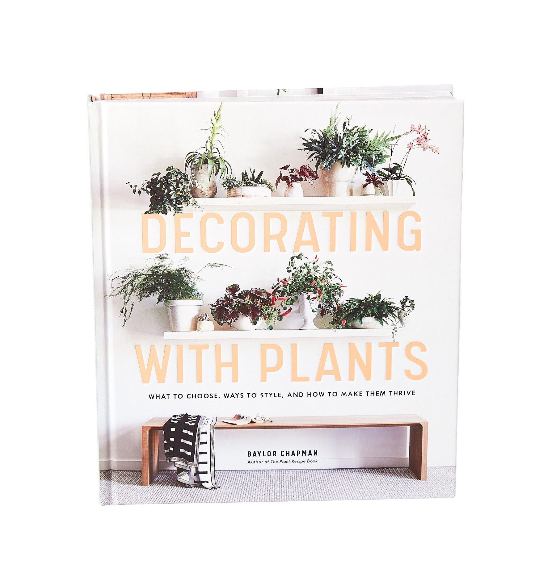 Best garden nursery near me offering a book on decorating with plants.