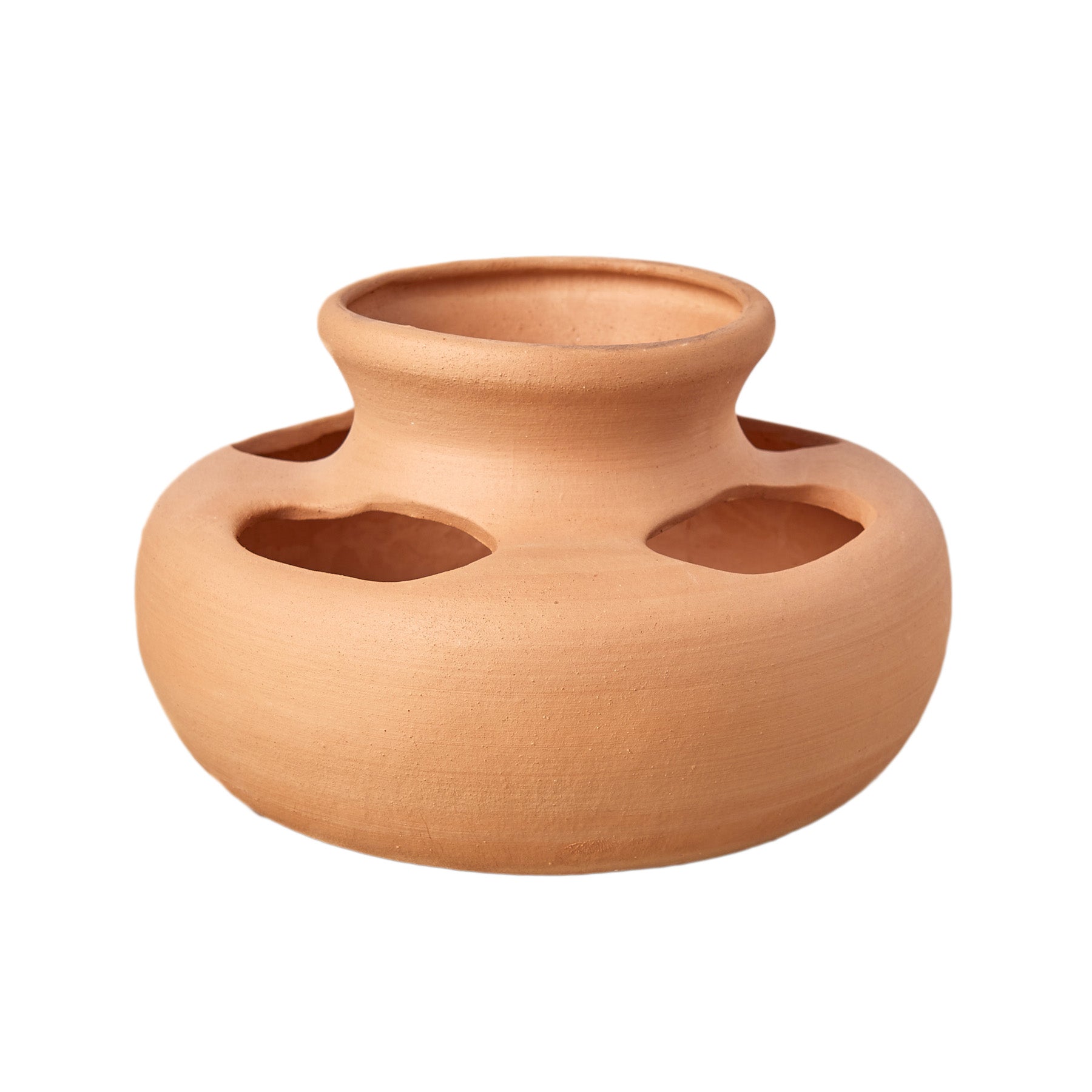 A small clay pot with a hole in the middle, perfect for your gardening needs at the best garden center near me.