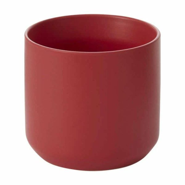 A plain red cylindrical ceramic cup with a smooth finish and no handle.
