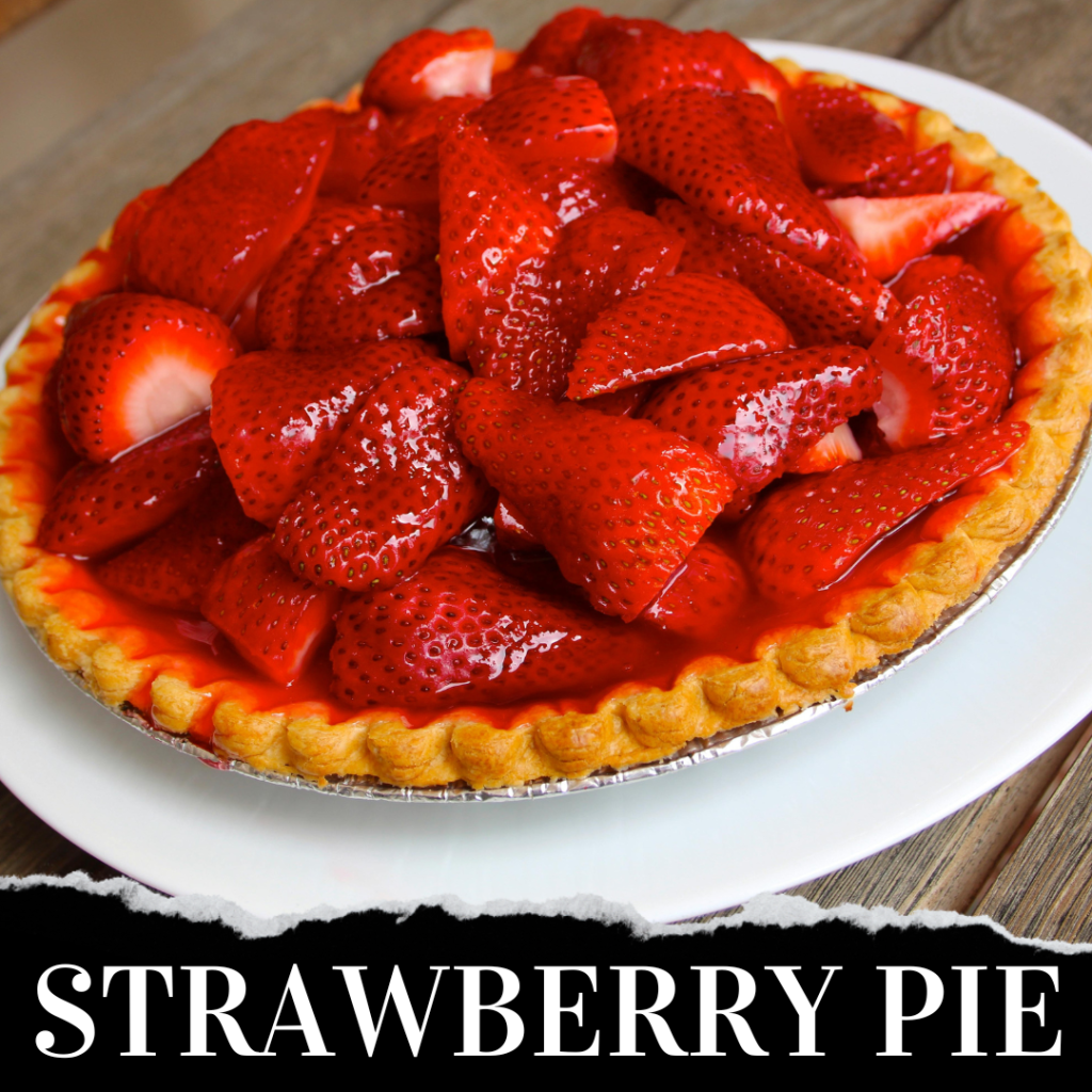 A strawberry pie with glossy, fresh strawberries piled on top of a golden crust, placed on a white plate.